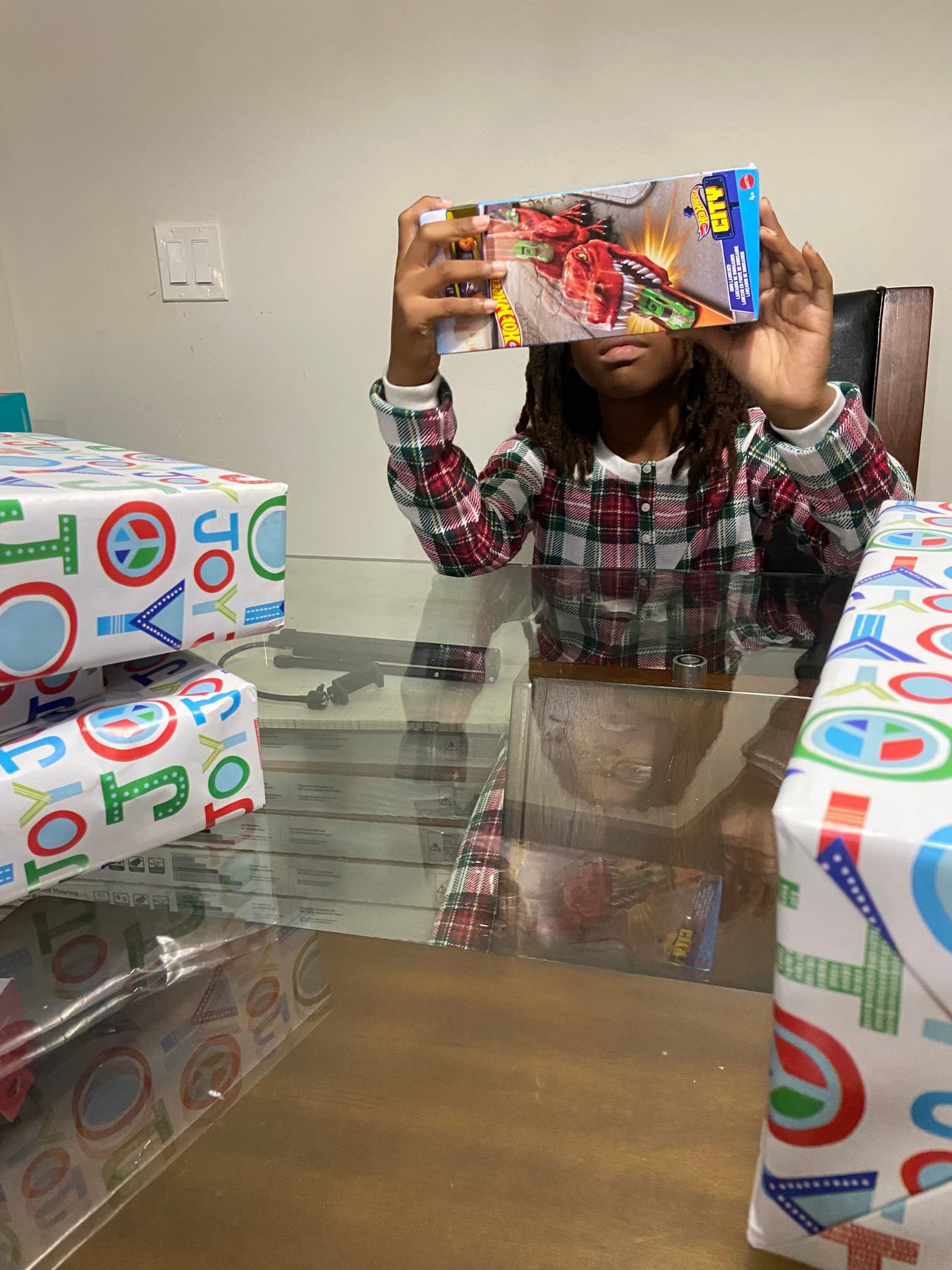 A child holding a wrapped holiday present