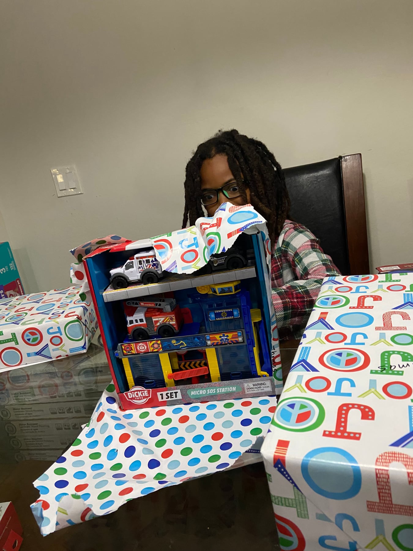 A child opening an imaginative playset gift