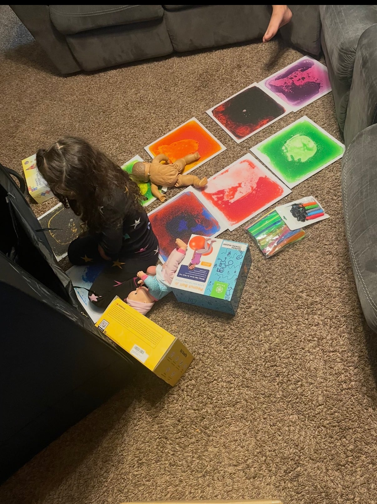 A child using colorful sensory activity panels at home