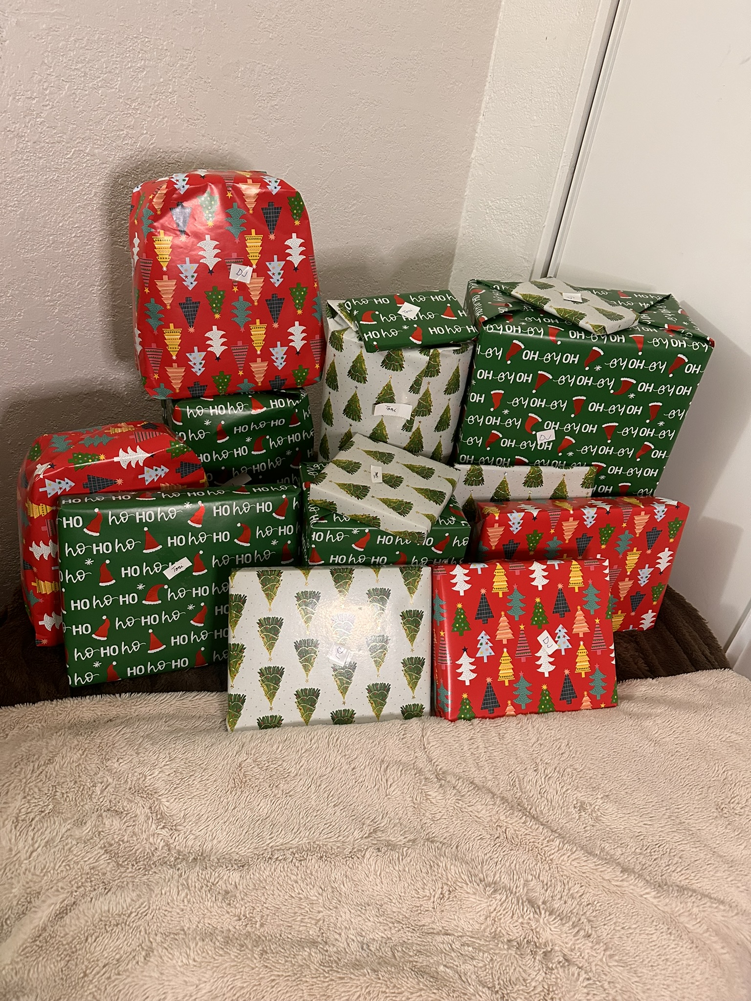 Red, green and silver wrapped gifts arranged for families