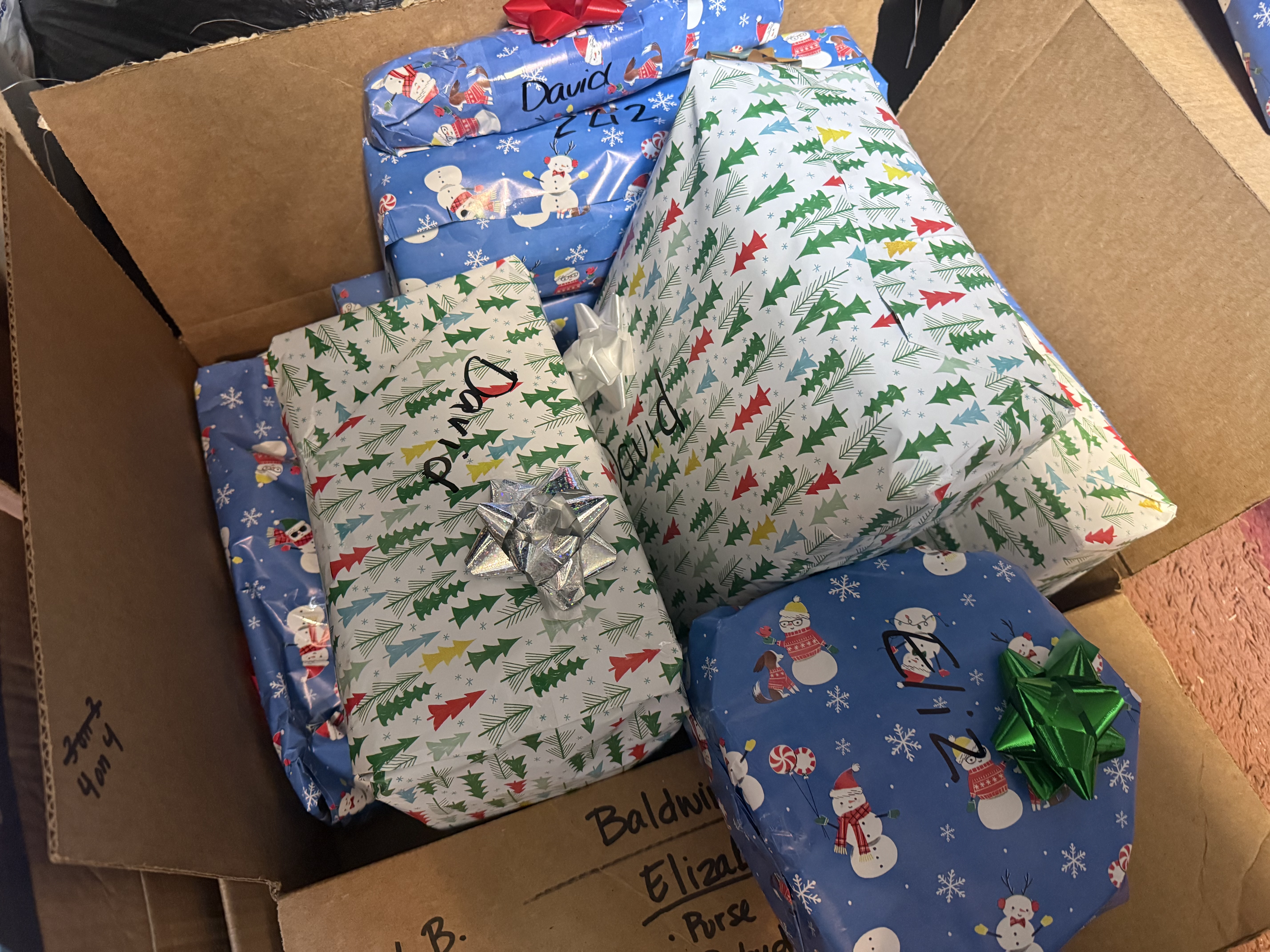 Boxes filled with individually wrapped holiday gifts