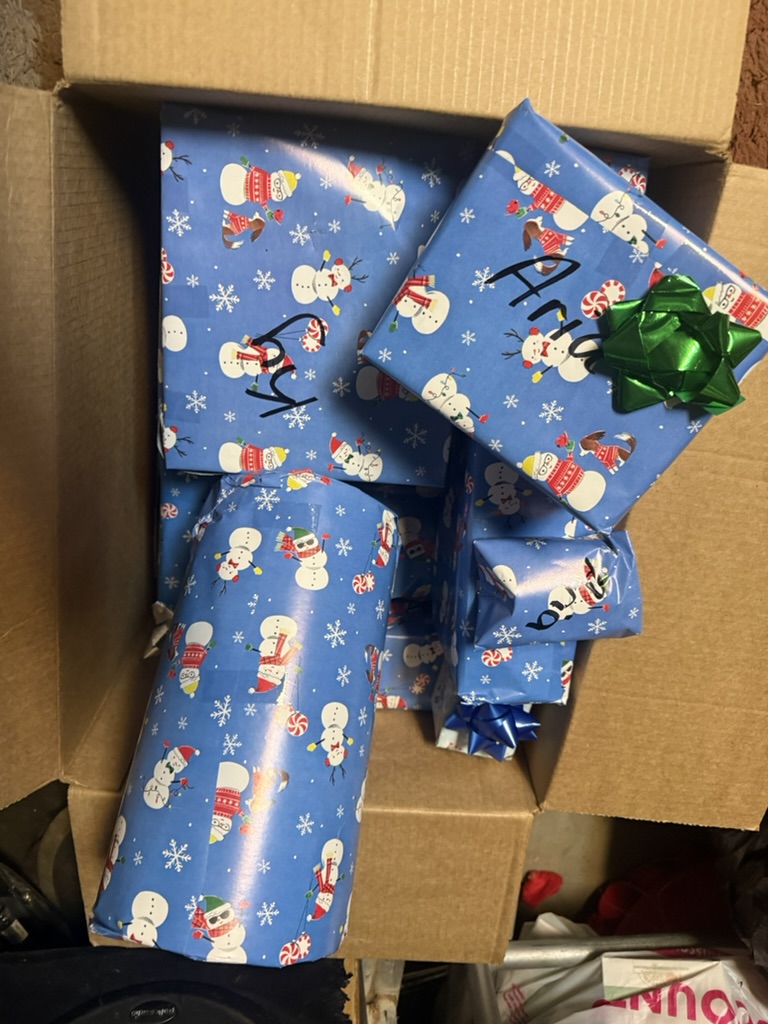 Individually labeled blue Christmas presents