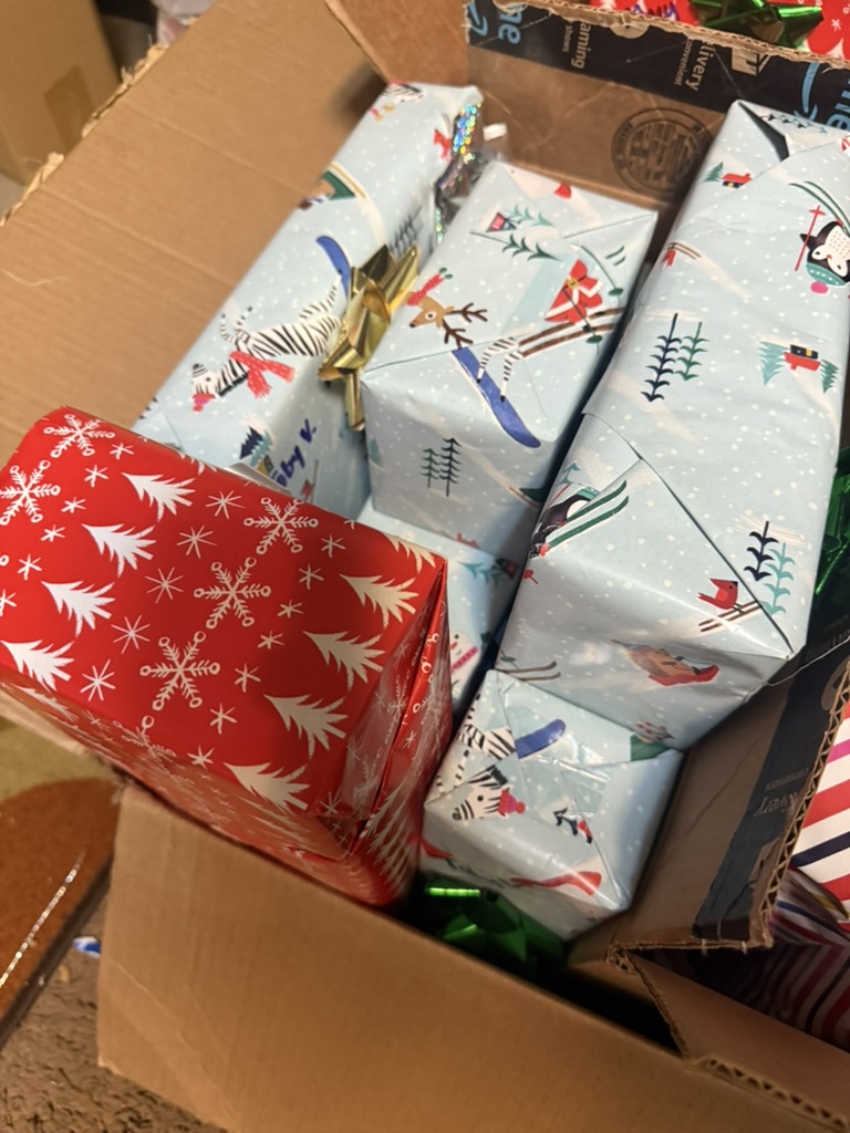 Red and blue wrapped gifts packed for delivery