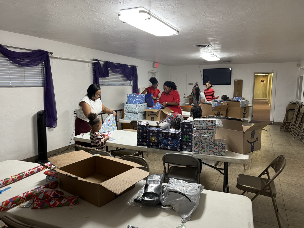 Volunteers preparing and organizing Christmas gifts