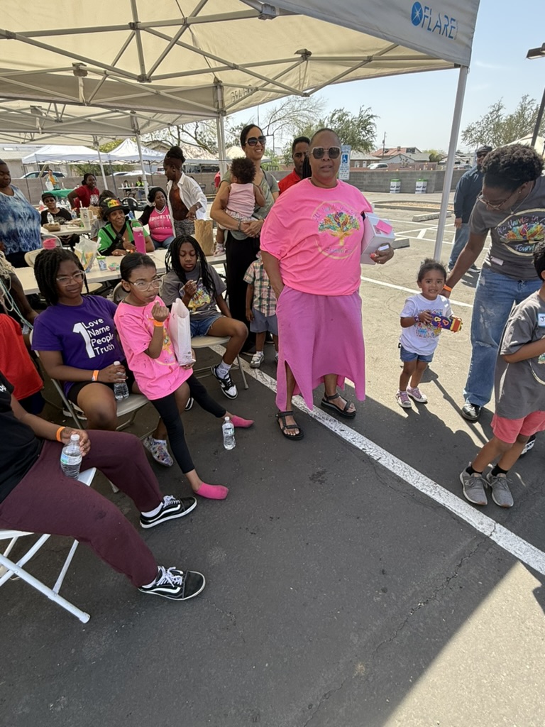 Foundation team members and children gathering together at the first community event