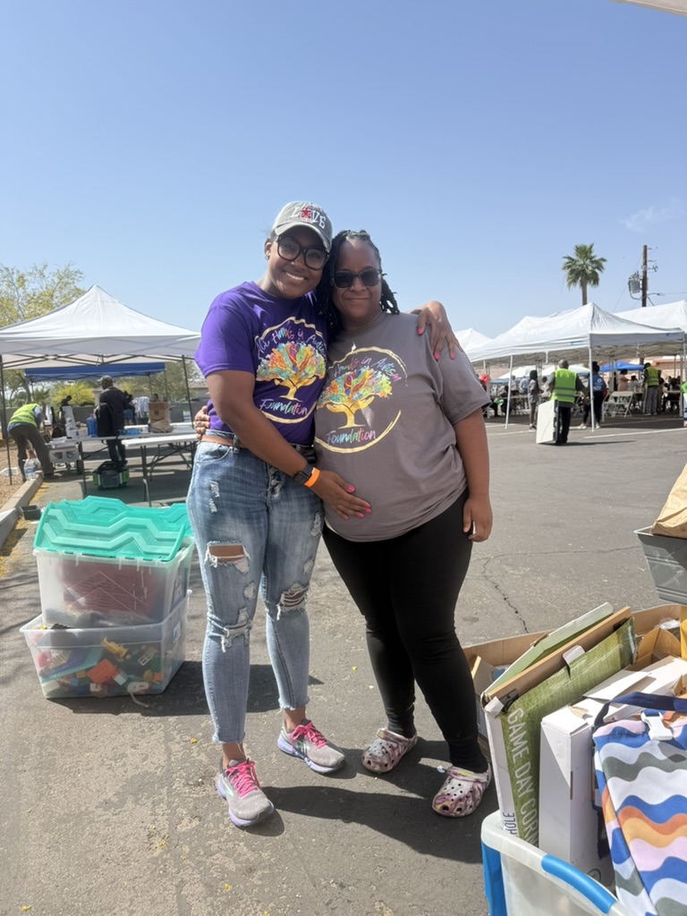 Two foundation team members standing together at the event