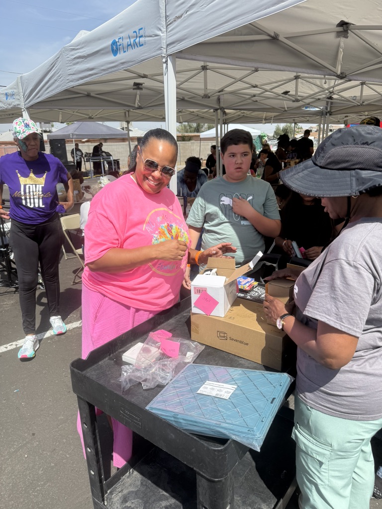 Foundation volunteers welcoming families at an activity table