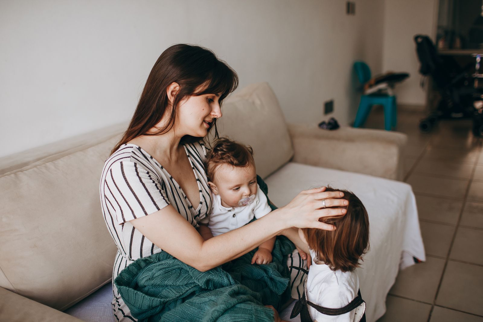 Representative image of a parent connecting with two children at home